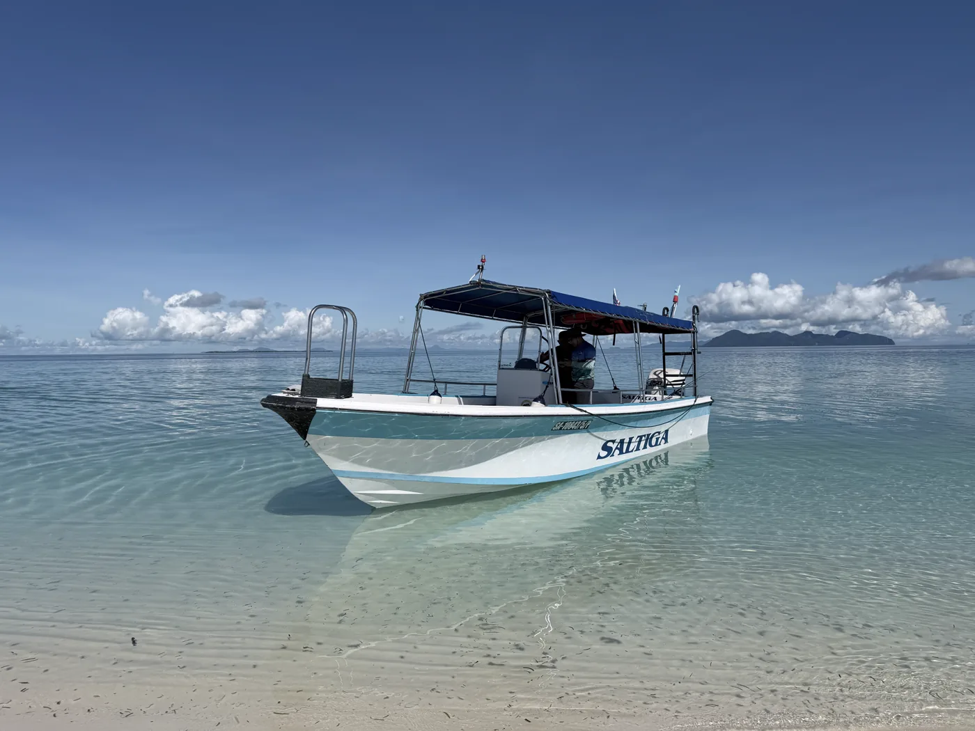 The Saltiga boat moored on a Semporna beach